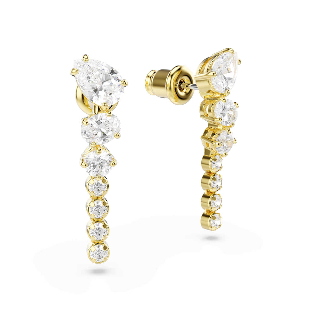 Swarovski Mesmera drop earrings by Swarovski, featuring mixed-cut round and teardrop-shaped clear gemstones in a vertical row with an elegant 18K gold finish, expertly crafted as statement jewelry and displayed against a white background.
