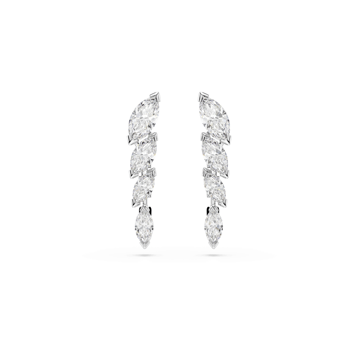 A pair of Swarovski Mesmera earrings by Swarovski, each featuring five marquise-cut Swarovski Zirconia arranged in a graceful, ascending curve and finished with a luminous rhodium plating—a striking update on classic elegance, showcased against a simple white background.