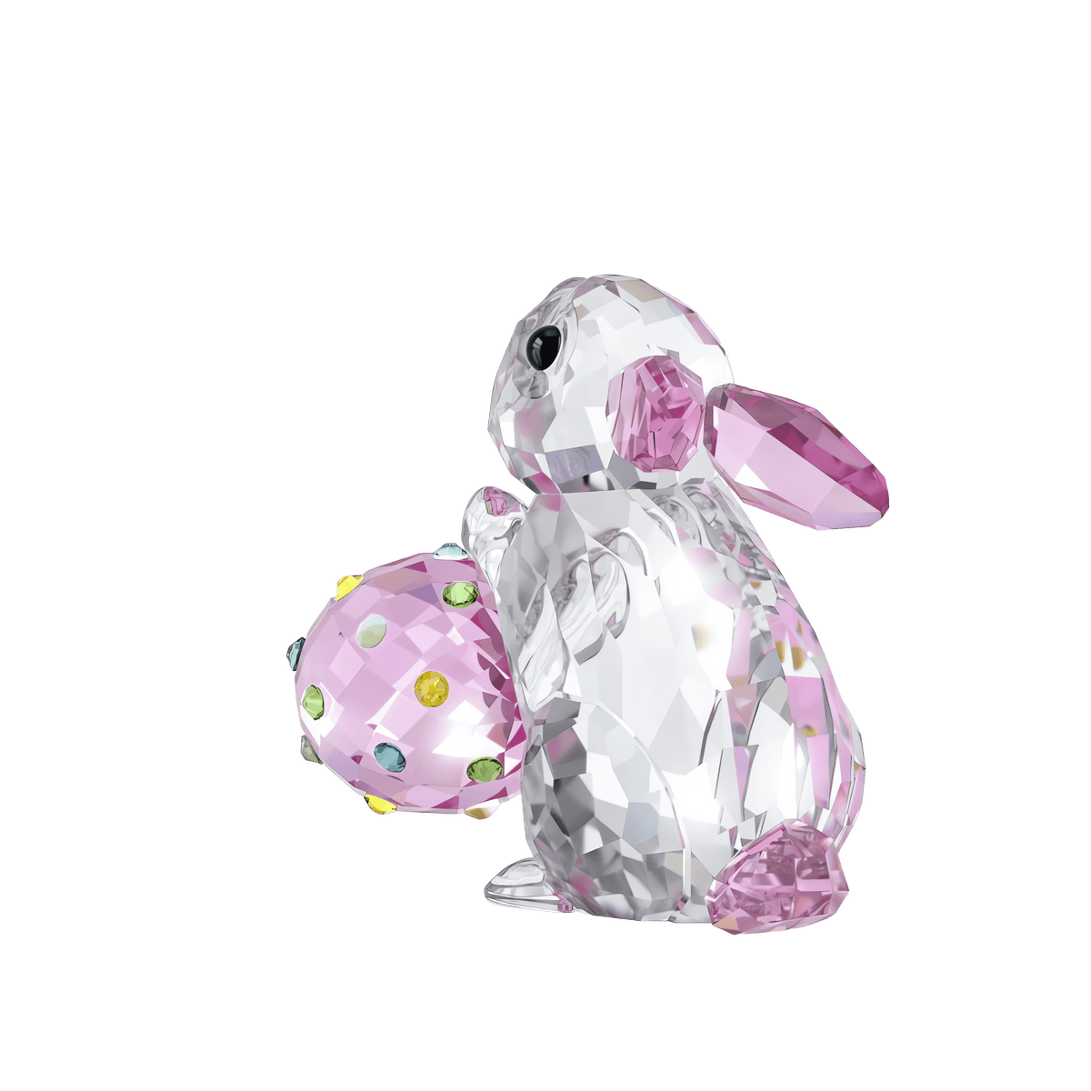 The Swarovski Idyllia Rabbit and Egg by Swarovski features a delightful crystal rabbit with pink-accented ears and feet, holding a vibrant, gem-embellished pastel egg, set against a simple white background. This charming collectible is offered by prominent retailers including Raffi Jewellers and Swarovski Canada.