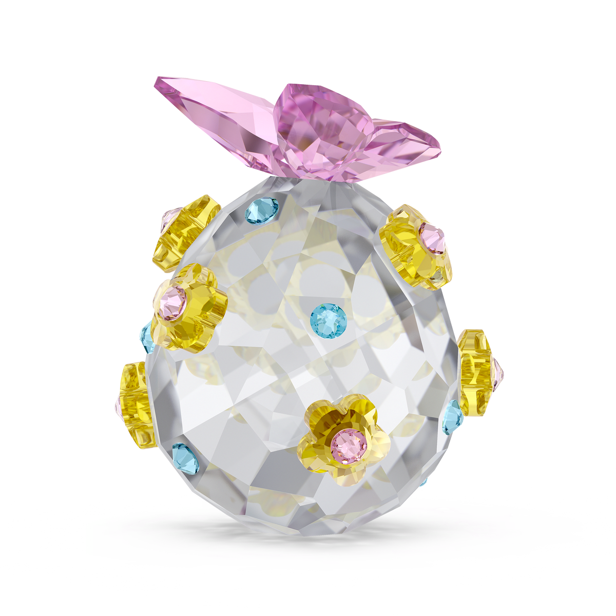 A brilliantly clear, intricately faceted crystal egg—Swarovski Idyllia Egg Annual Edition 2026 Style Number by Swarovski—is adorned with delicate yellow and pink flower-shaped gems, sparkling blue round gems, and crowned with a faceted pink crystal bow. Presented against a pristine white background, this exquisite collectible perfectly embodies the timeless elegance for which Swarovski Canada is renowned.