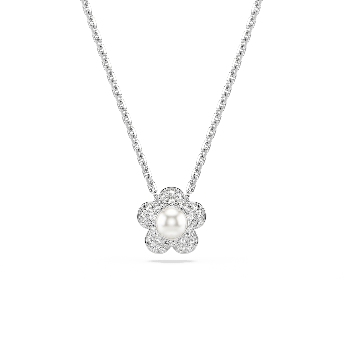 The Swarovski Ariana Grande x Swarovski set features a rhodium plated pendant in the shape of a crystal flower, showcasing a central pearl and round-cut petals embellished with sparkling stones, beautifully displayed on a white background.