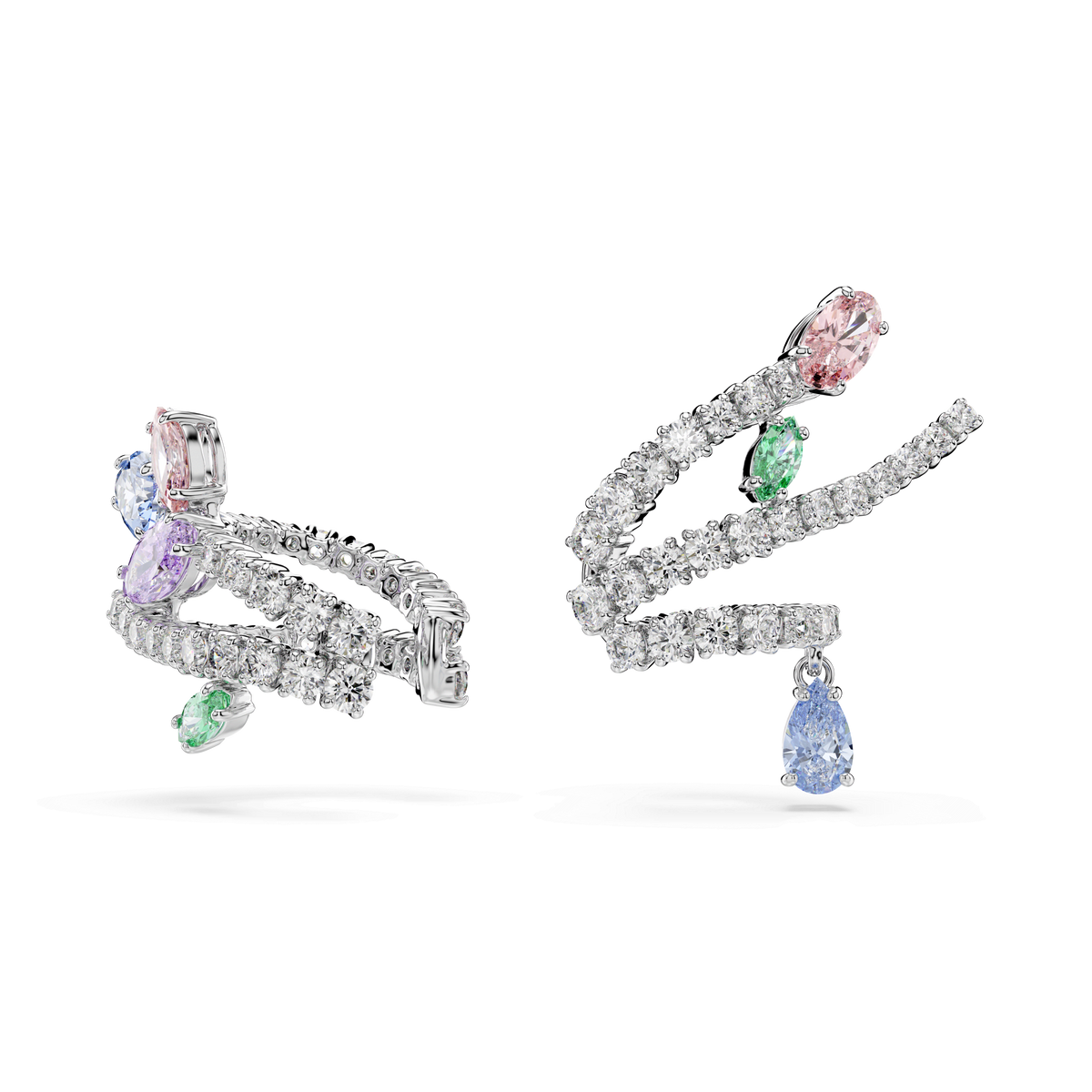 The Swarovski Ariana Grande x Swarovski ear cuffs, mixed cuts in multicolored gemstones and rhodium plated for extra shine, feature swirling lines set with clear, pink, purple, and green stones accented by sparkling Swarovski Zirconia—with a single dangling blue gemstone adorning one ear cuff. Presented elegantly against a plain white background.