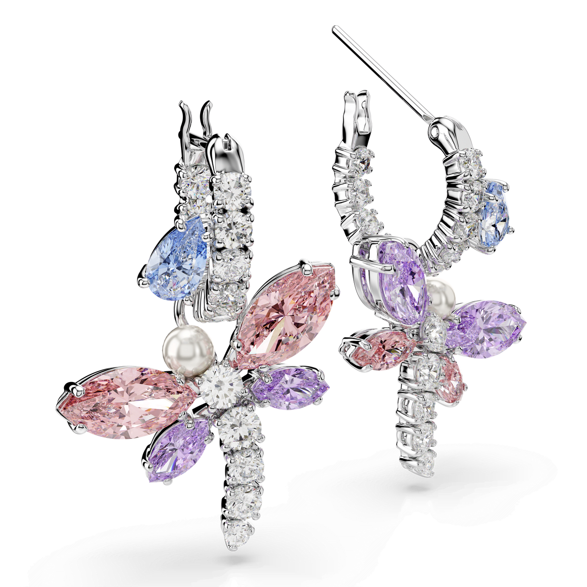 The Swarovski Ariana Grande x Swarovski drop earrings are rhodium-plated and crafted in the shape of dragonflies, featuring mixed-cut, multicolored gemstones—including pink, purple, and blue hues—with sparkling Swarovski Zirconia and a crystal pearl detail on each dragonfly’s body, presented against a white background.