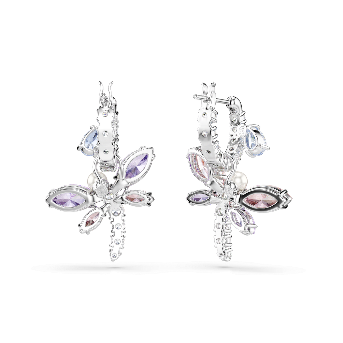 The Swarovski Ariana Grande x Swarovski Dragonfly drop earrings feature mixed-cut crystals in pastel purple, pink, and blue hues, accented with small pearls and intricate floral and leaf motifs reminiscent of delicate dragonflies. Rhodium plated for a brilliant finish, these multicolored earrings are displayed against a plain white background.