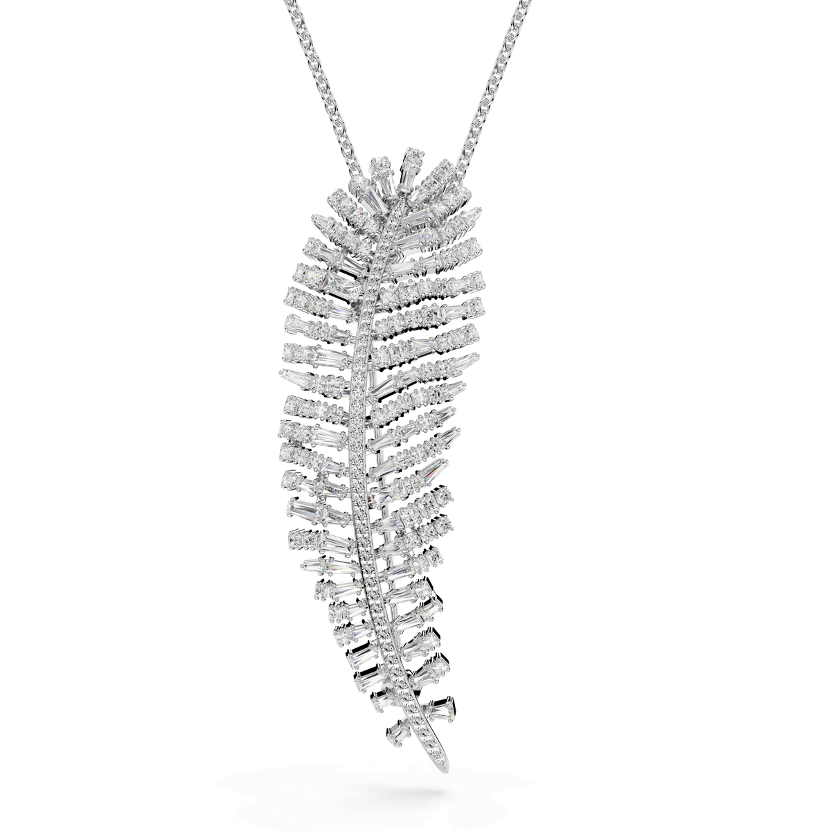 The Swarovski Vienna pendant and brooch features a delicate feather motif in white, crafted with mixed cuts of sparkling Swarovski Zirconia set along its elegantly curved, rhodium-plated form. Showcased against a white background, this dazzling piece from the Vienna Collection by Swarovski epitomizes the timeless allure of feather jewelry.