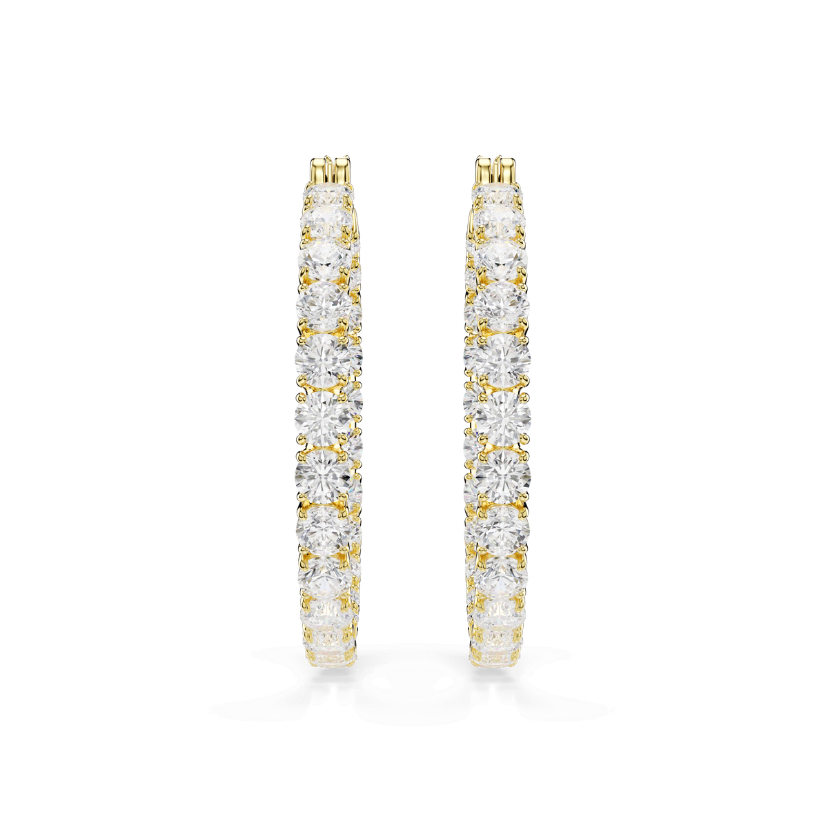 A pair of Swarovski Matrix hoop earrings, featuring a white 18K gold finish and embellished with round-cut crystals in a shimmering row along the front outer edge, is displayed against a plain white background.