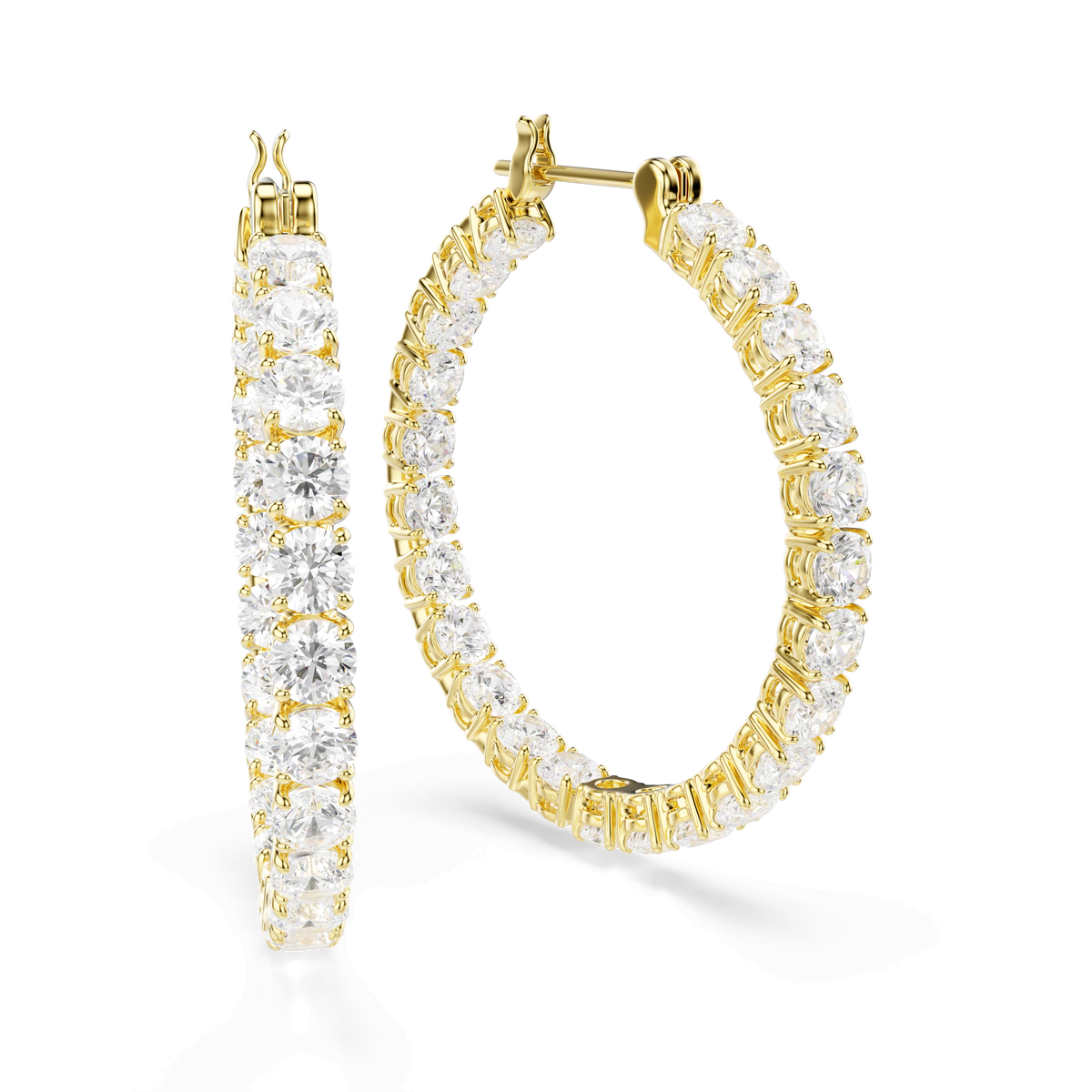 Swarovski Matrix hoop earrings, featuring a radiant 18K gold finish and brilliant round-cut white crystals, are showcased with one earring standing elegantly while the other rests flat on a white background, emphasizing their contemporary design and sparkling allure.