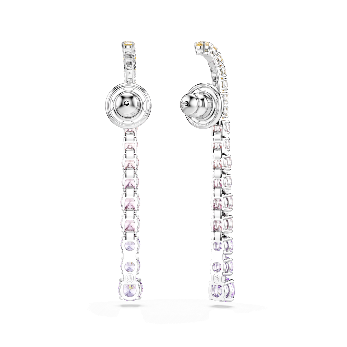 Swarovski’s Matrix drop earrings feature a modern, geometric silhouette with a gradient of multicolored round cuts. Each long, rhodium-plated earring showcases sparkling crystals and is photographed against a plain white background.