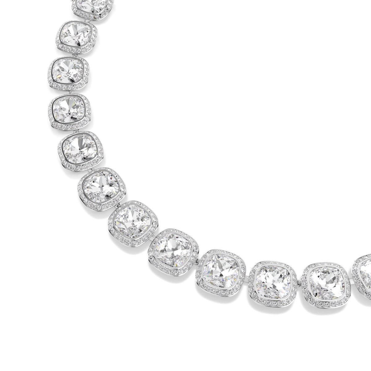 A close-up of the Swarovski Una Angelic necklace showcases cushion-cut white crystals set in rhodium plating, arranged elegantly in a curved line against a white background, capturing the radiant brilliance characteristic of Swarovski.