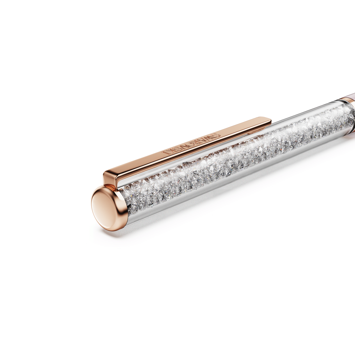 A close-up of the Swarovski SS Crystalline Ballpoint Pen in pink with a rose gold cap and clip, featuring a barrel filled with sparkling crystals against a white background. Available at Raffi Jewellers, this elegant writing instrument exemplifies the signature craftsmanship and sophistication for which Swarovski is celebrated in Canada.