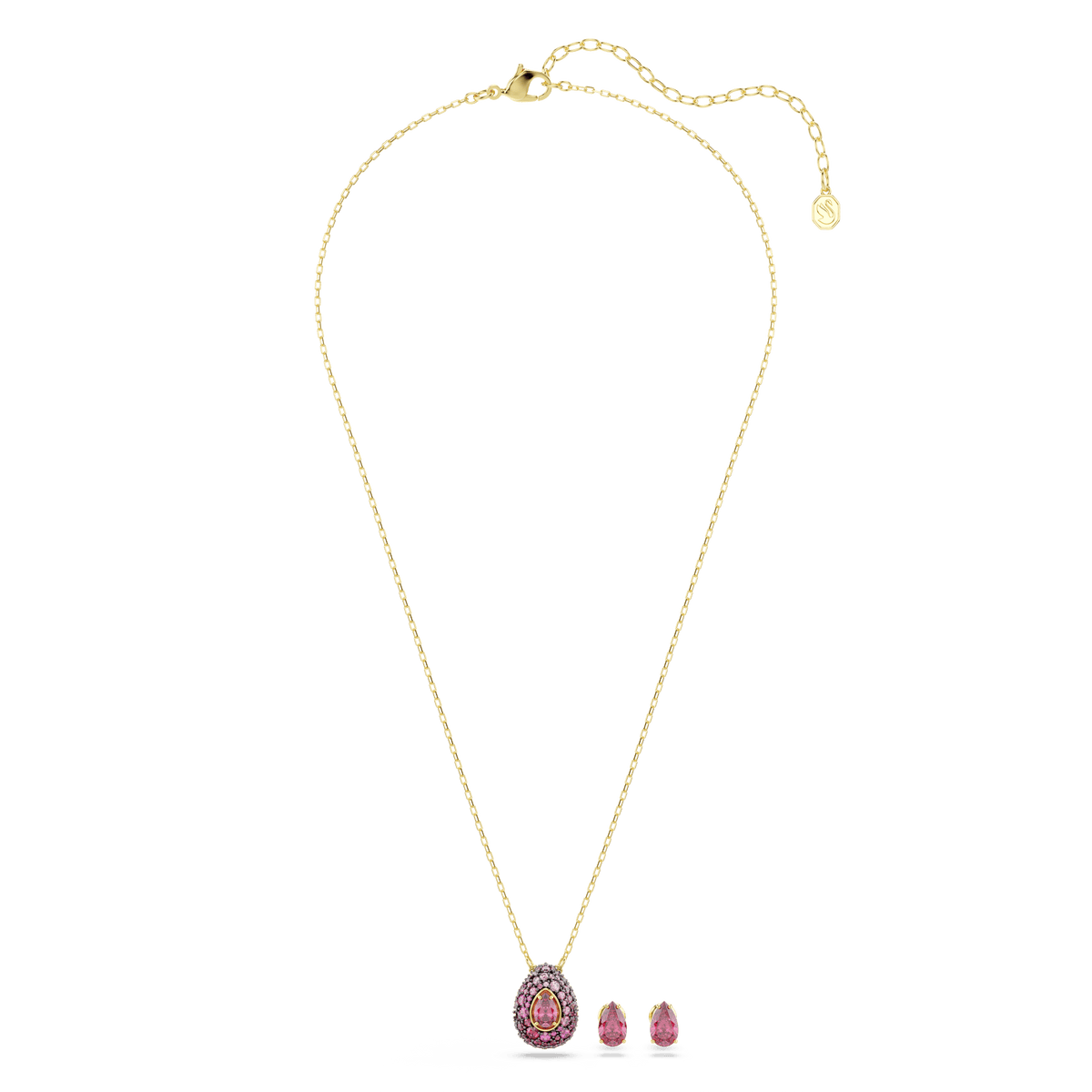 The Swarovski Sublima set features a gold-finished chain necklace with a pear-cut red pendant, accompanied by a matching pair of teardrop-shaped earrings, displayed on a white background.