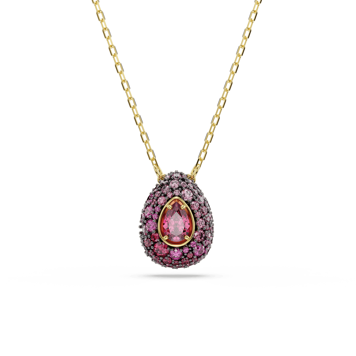 A gold chain necklace from Swarovski’s Sublima set showcases a pear-cut red pendant adorned with sparkling Swarovski Zirconia and finished in luxurious 18K gold.