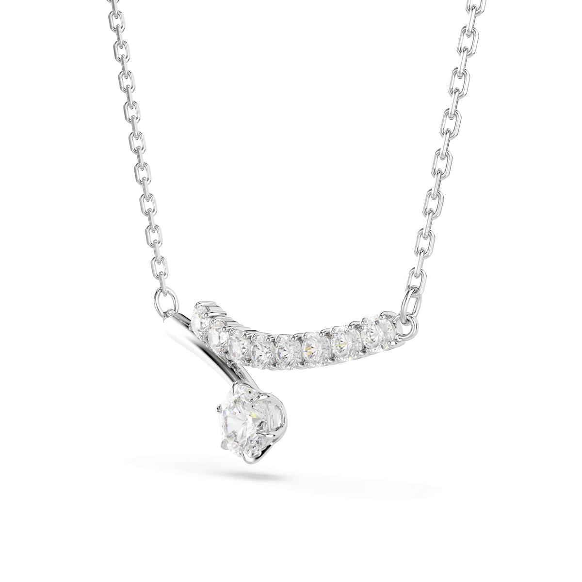 Introducing the Swarovski Matrix necklace: a rhodium-plated piece featuring a curved pendant set with sparkling clear Swarovski Zirconia in an elegant DNA-inspired design, accented by a single larger round-cut stone suspended below.