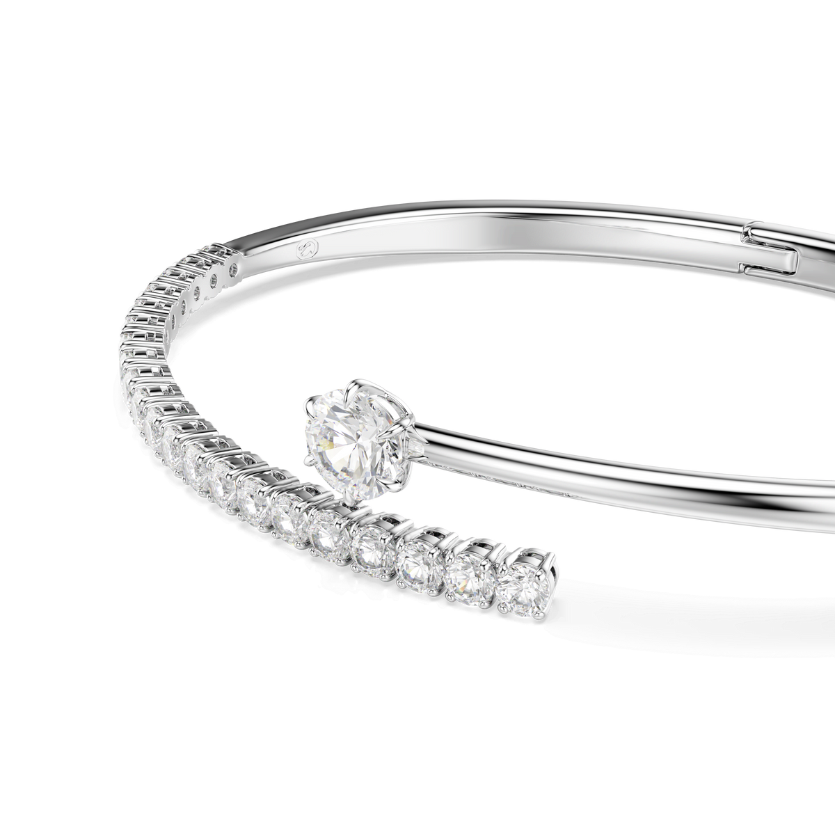 The Swarovski Matrix bangle, crafted in rhodium plating, features round-cut white crystals in a sophisticated design reminiscent of a DNA helix, elegantly displayed on a white background.