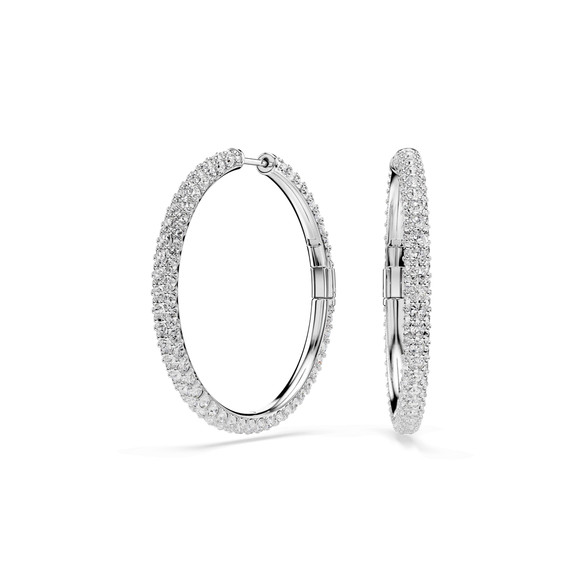 Two large, round-cut Swarovski Dextera hoop earrings, plated in rhodium and adorned with white crystals, are displayed upright against a plain white background.
