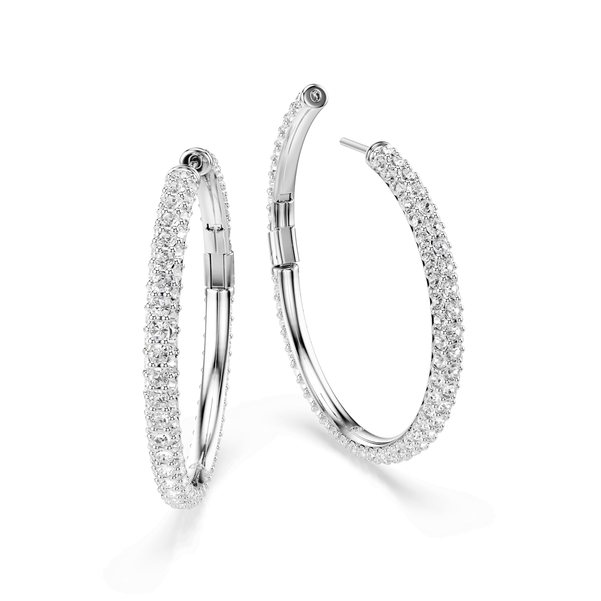 A pair of Swarovski Dextera hoop earrings, featuring round-cut white crystals in a pavé setting and finished with rhodium plating, displayed on a white background.