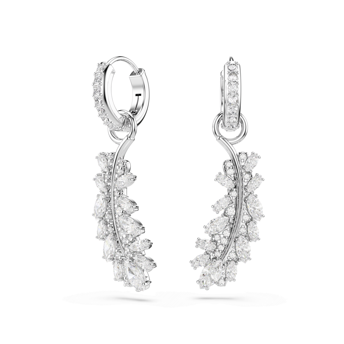 Experience the sophistication of Swarovski with the Vienna earrings, a rhodium plated design from the Vienna Collection. These white feather earrings showcase mixed-cut Swarovski Zirconia gemstones in a graceful curve, beautifully presented against a plain white background.