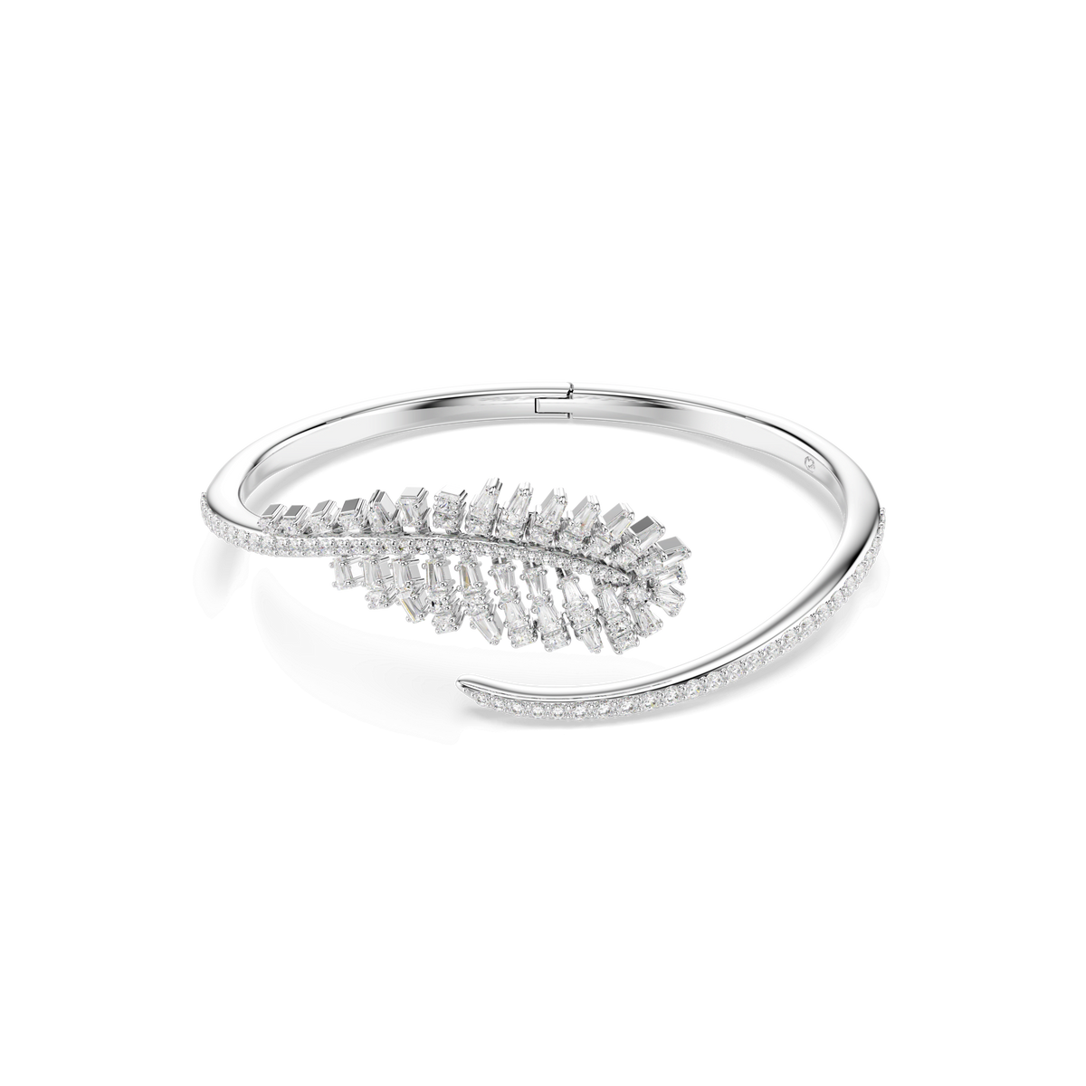 A Swarovski Vienna bangle from the Feather collection, crafted in rhodium-plated metal with mixed-cut clear Swarovski Zirconia gemstones in a delicate feather design, is displayed on a plain white background.