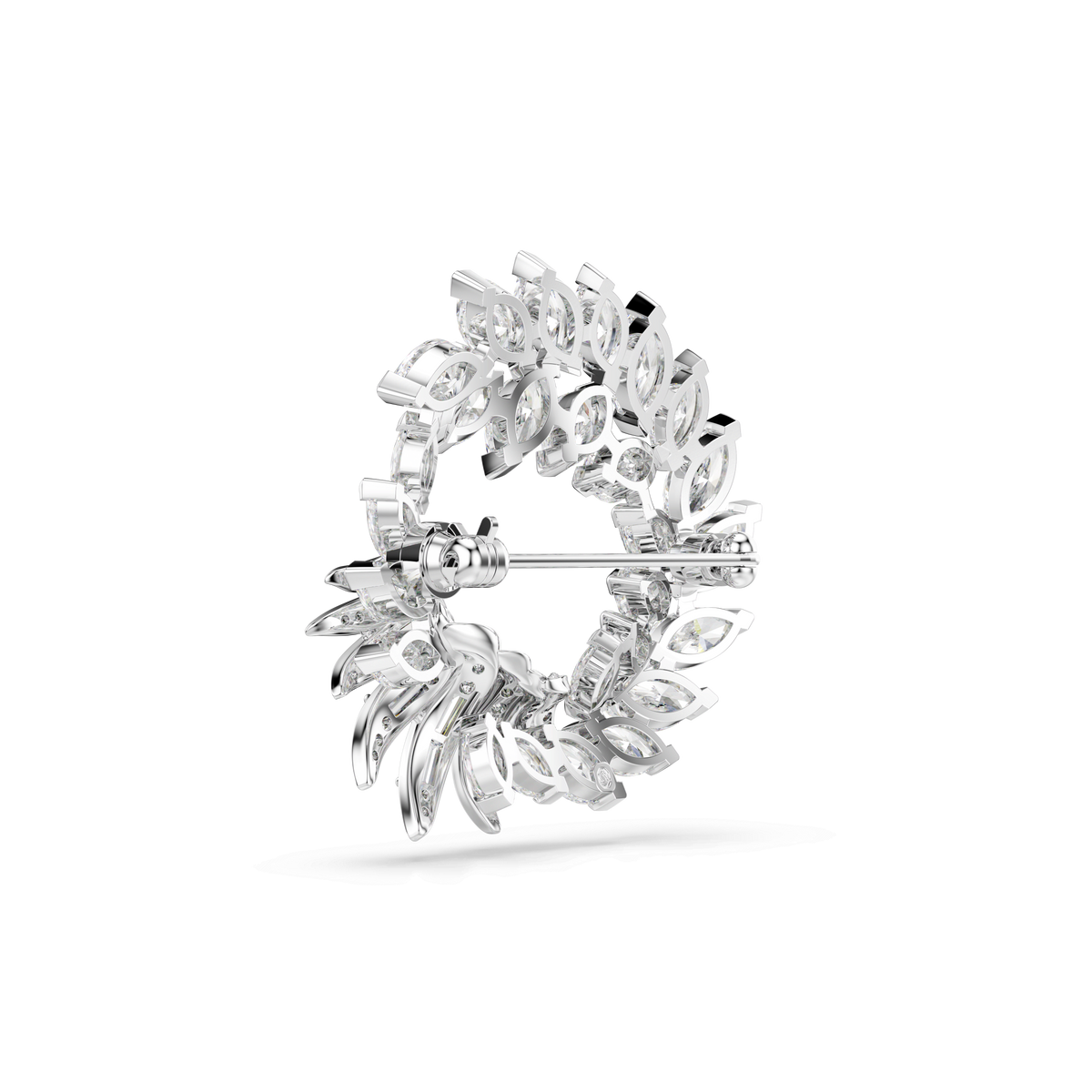 The Swarovski Mesmera brooch by Swarovski features marquise-cut white crystals arranged in a circular, layered wreath design, crafted with rhodium-plated metal and finished with a secure pin clasp on the back.