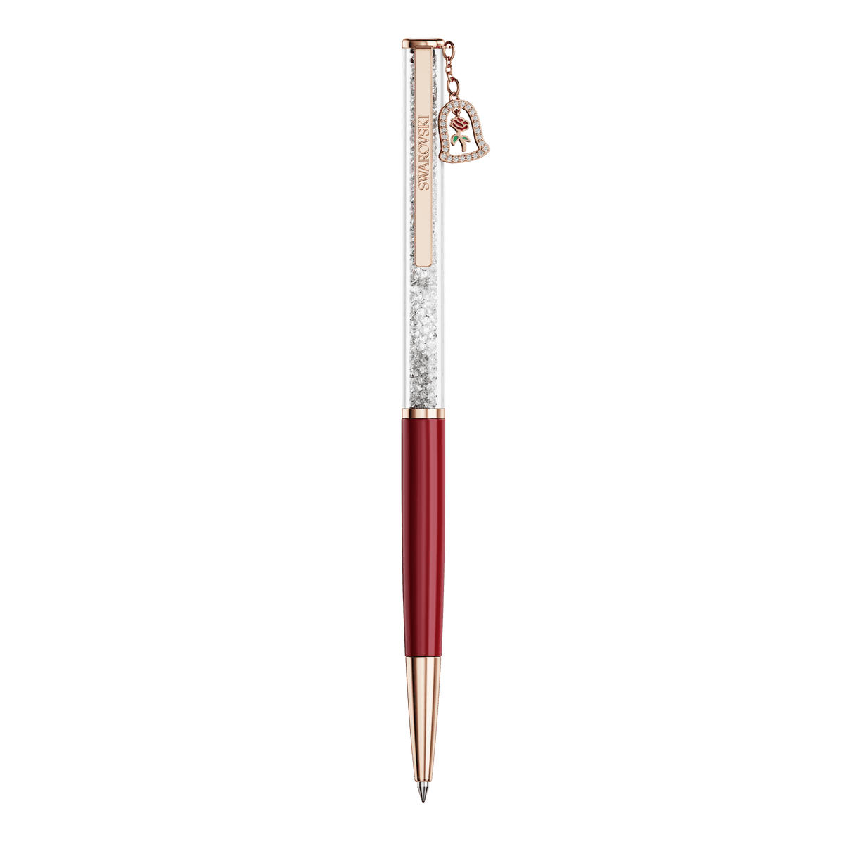 Experience the magic of Beauty and the Beast with the Swarovski Crystalline ballpoint pen, Bell. This red lacquered pen features a rose gold-tone plated finish and a transparent barrel filled with sparkling crystals, reminiscent of an enchanted rose. A delicate heart-shaped charm adorned with a red ribbon detail hangs from the top. Captured against a plain white background, this stunning accessory embodies timeless romance and elegance.