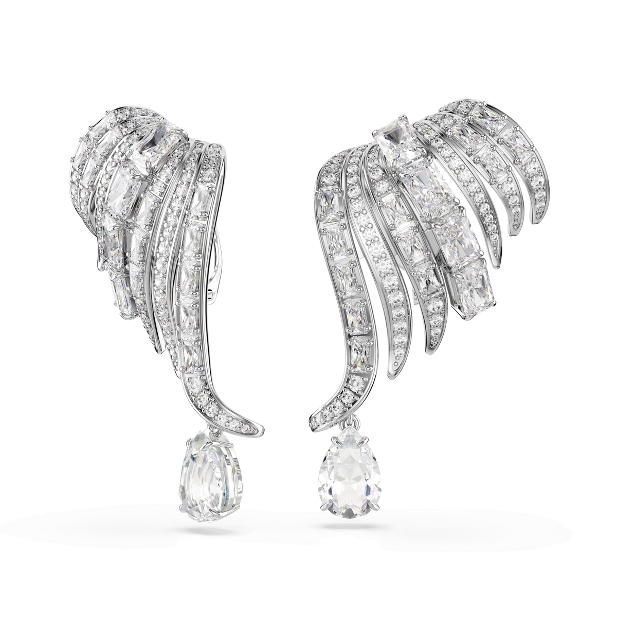 Swarovski Vienna clip earrings, crafted with mixed cuts in a swan-inspired, asymmetrical design, showcase elegant curves and wing-like forms in rhodium-plated silver. Encrusted with sparkling Swarovski Zirconia and featuring large teardrop-shaped gemstones that dangle gracefully, these earrings embody the timeless sophistication of the Vienna Collection.