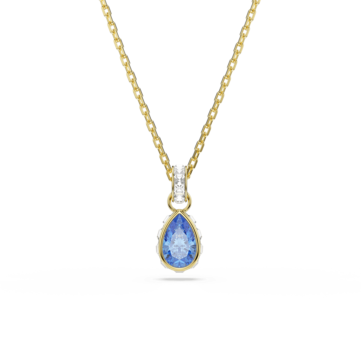 The Swarovski Chroma pendant features a pear-cut blue stone set in an 18K gold finish, accented by a delicate row of clear crystals above the gem. Photographed against a white background to showcase its elegance, this necklace pairs beautifully with matching earrings for a refined ensemble.
