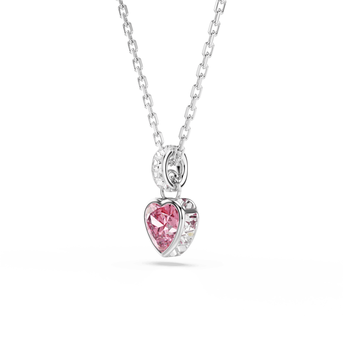 Displayed on a plain white background, the Swarovski Chroma pendant by Swarovski features a radiant pink centerpiece crafted in mixed cuts and accented with sparkling clear jewels around the edge. This rhodium-plated necklace elegantly showcases the brilliance of multicolored jewelry in its stunning design.