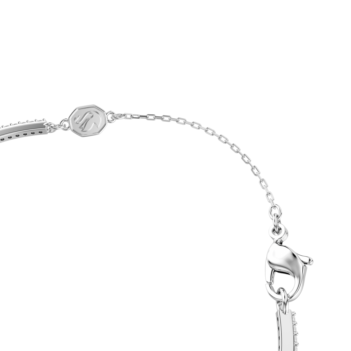 A close-up of the Swarovski Una Angelic bangle showcases mixed-cut green crystals set in a sleek rhodium-plated design, exuding the refined elegance characteristic of Swarovski craftsmanship.