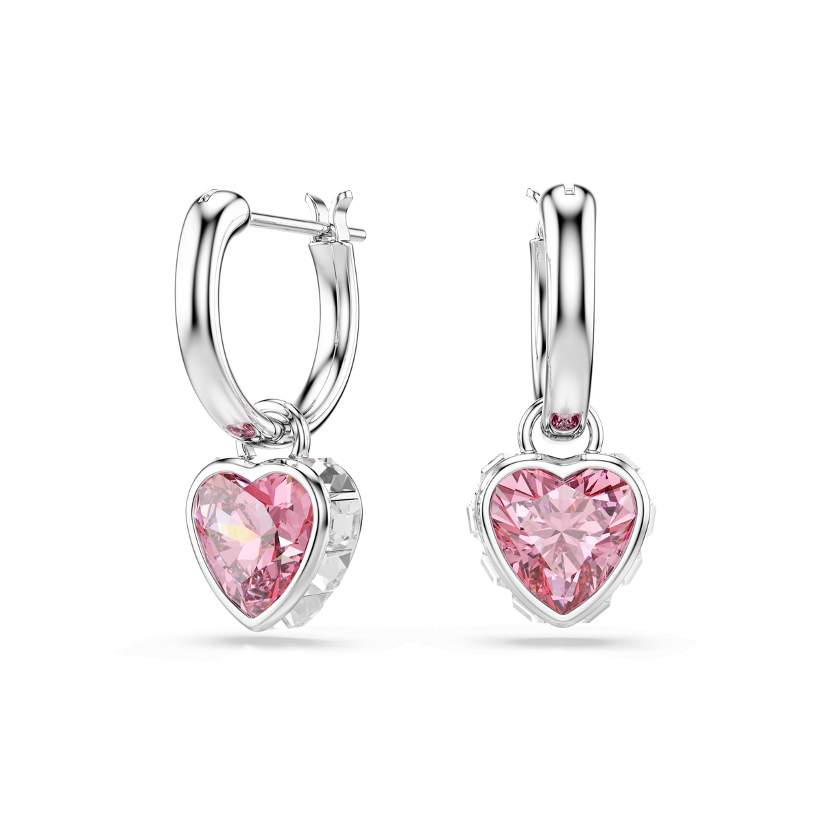 Swarovski Chroma drop earrings, featuring pink heart-shaped Swarovski crystals set in a rhodium-plated silver frame, are displayed on a plain white background.