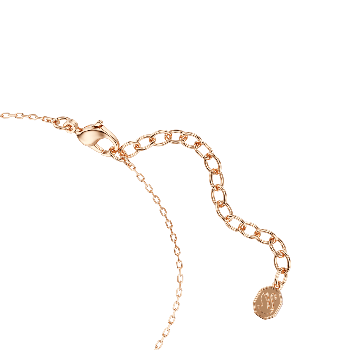A close-up of a delicate Swarovski Only bracelet featuring a round cut pink centerpiece, crafted with an 18K rose gold finish, and completed with a lobster clasp and adjustable extension chain ending in a small, textured round charm—this radiant piece epitomizes the brand’s refined elegance.