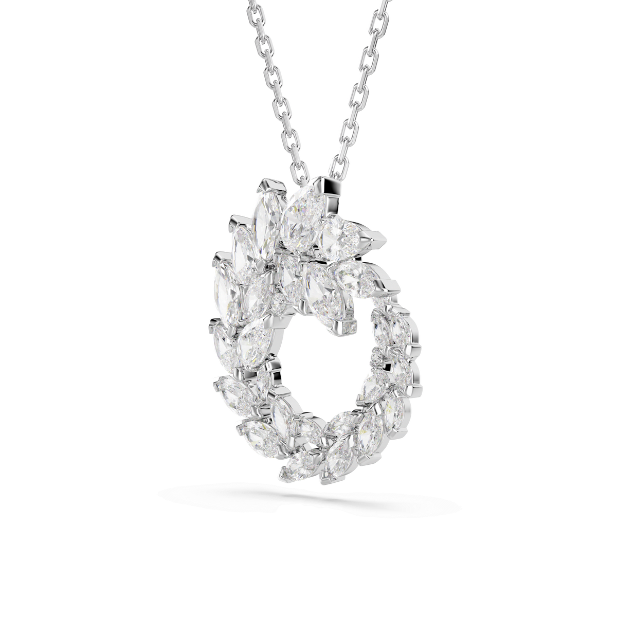 The Swarovski Mesmera pendant features a circular arrangement of marquise-cut white Swarovski Zirconia, elegantly set on a delicate rhodium-plated chain and showcased against a plain white background.