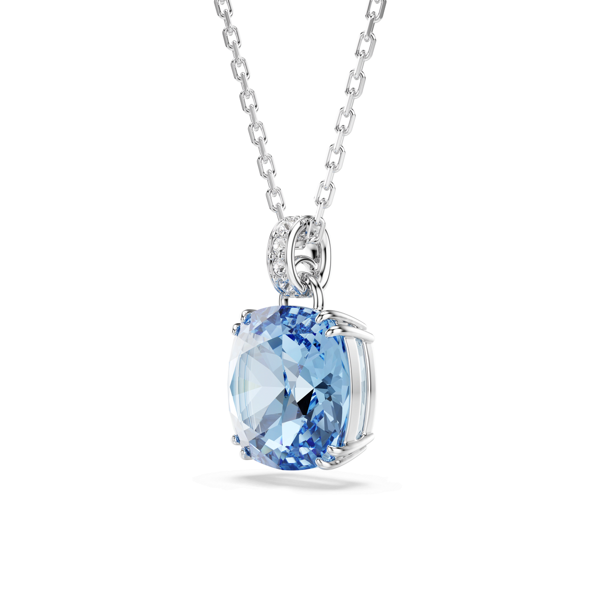 The Swarovski Millenia pendant features a cushion-cut blue Swarovski ReCreated crystal set in rhodium plating, with small white stones accenting the bail, shown against a plain white background.