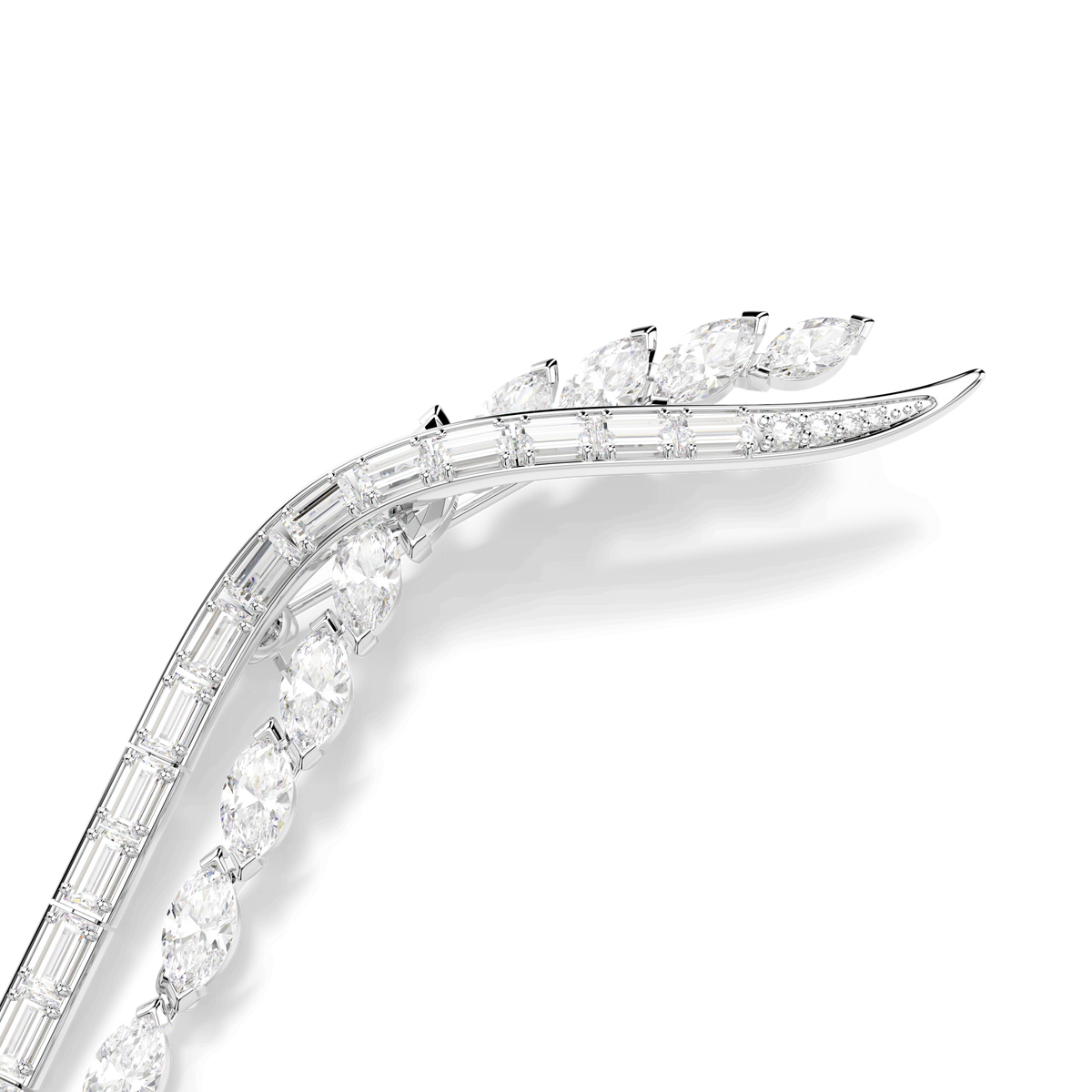 A close-up of the Swarovski Mesmera brooch by Swarovski, featuring an eye-catching jewelry design with mixed-cut stones—possibly including marquise and baguette shapes—accented by sparkling Swarovski crystals, all set in a curved, rhodium-plated white metal setting against a white background.