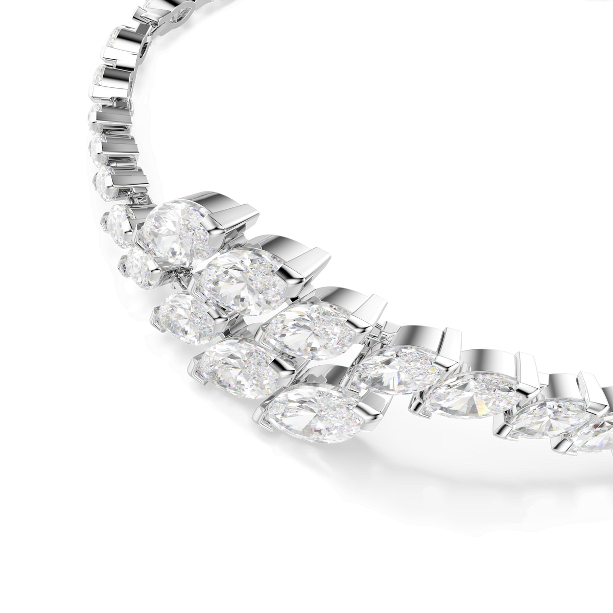 Close-up of the Swarovski Mesmera set, featuring three rhodium-plated pieces adorned with large, marquise-cut white Swarovski Zirconia arranged in a row, photographed on a white background. This dazzling jewelry set from Swarovski creates an elegant sparkle—perfect for holiday gifting.