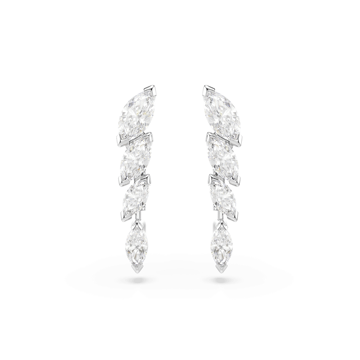 Discover the Swarovski Mesmera set, featuring three elegant pieces adorned with marquise-cut white Swarovski Zirconia, each meticulously set in a vertical arrangement on a sleek rhodium-plated base. Beautifully displayed against a white background, this sophisticated set from Swarovski is perfect for holiday gifting or completing your Mesmera jewelry collection.