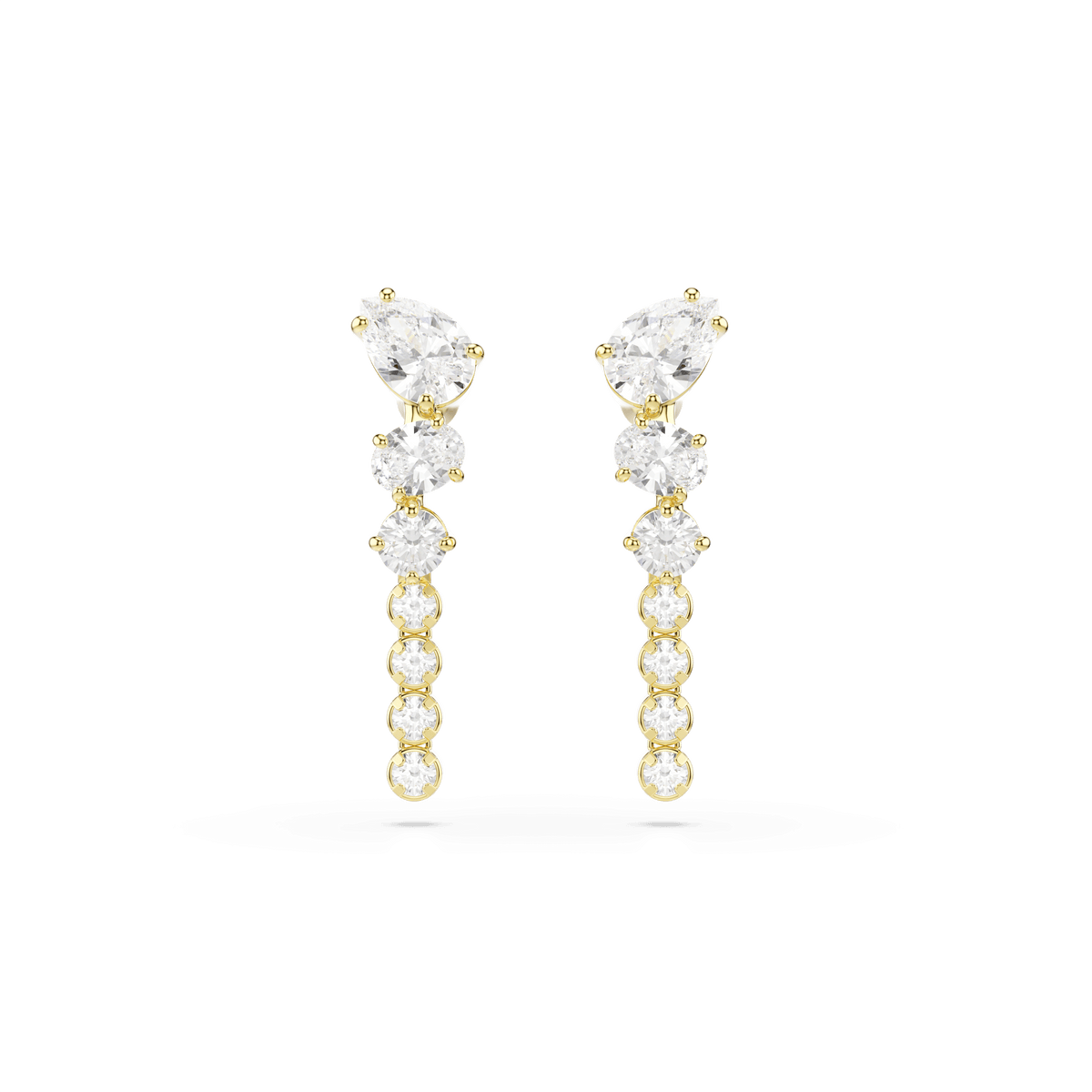 Swarovski Mesmera drop earrings by Swarovski feature a vertical row of round white stones in a dangling cup chain design, topped with a larger pear-shaped gemstone. Finished in 18K gold and set against a plain white background, these statement earrings with mixed cuts are the perfect accessory for any elegant occasion.