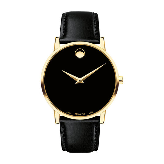An elegant wristwatch showcasing a yellow gold PVD case and a minimalist black dial, marked by a single golden dot at the 12 o'clock position alongside two slender hands. The black leather strap enhances its classic appeal, capturing timeless elegance in this Movado Museum Classic Quartz 40mm Watch.