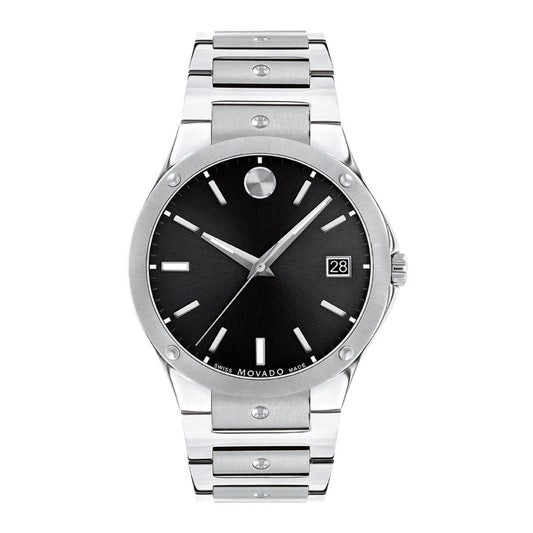 The Movado SE Quartz 41mm Watch boasts a sleek stainless steel case, black sunray dial, silver markers, date display at 3 o’clock, and a minimalist face, complemented by a timeless silver link bracelet.