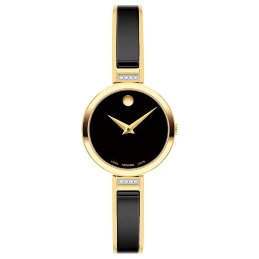 Introducing the Movado Moda Quartz 24mm Watch by Movado, this elegant timepiece showcases a minimalist design with a striking gold and black color scheme. It features a fully black dial that possesses no hour markers, highlighted by a single gold dot at the 12 o'clock position and complemented by slim gold hands. The strap is black accented with subtle gold details.