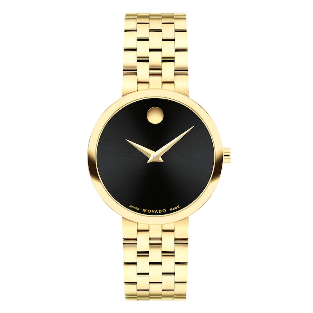 The Movado Museum Classic Quartz 29.5mm Watch for women features gold PVD stainless steel, a black minimalist dial with gold hands, signature dot at 12 o’clock, polished link band, and precise Swiss quartz movement.