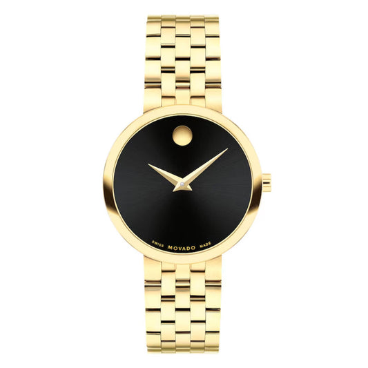 The Movado Museum Classic Quartz 29.5mm Watch for women features gold PVD stainless steel, a black minimalist dial with gold hands, signature dot at 12 o’clock, polished link band, and precise Swiss quartz movement.