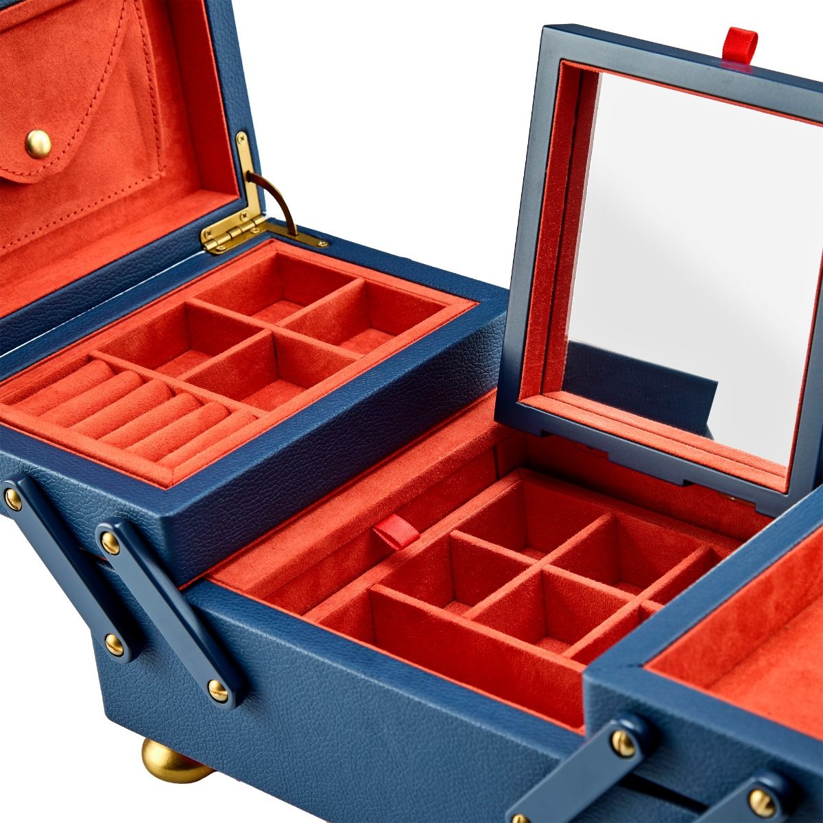 The WOLF 1834 Marla Aaron Baby Everything Jewellery Box features blue and orange vegan leather, multiple compartments, a built-in mirror, gold hinges, and a red velvet-lined interior for organizing your jewelry.