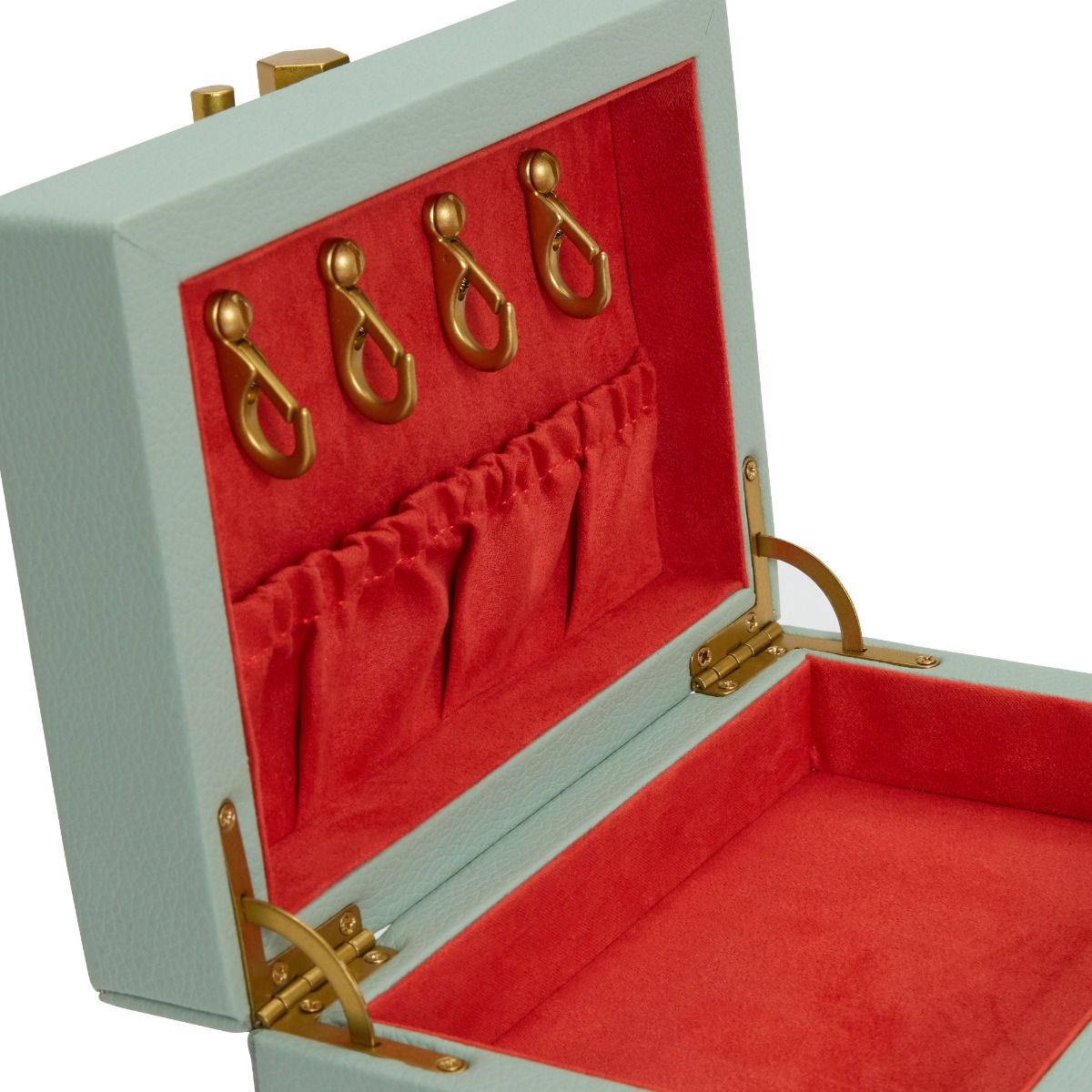 The WOLF 1834 Marla Aaron Baby Everything Jewellery Box by WOLF is a mint green vegan leather keepsake box with a red velvet interior, four gold hooks, four lid pockets, and a spacious main compartment for storing jewelry.