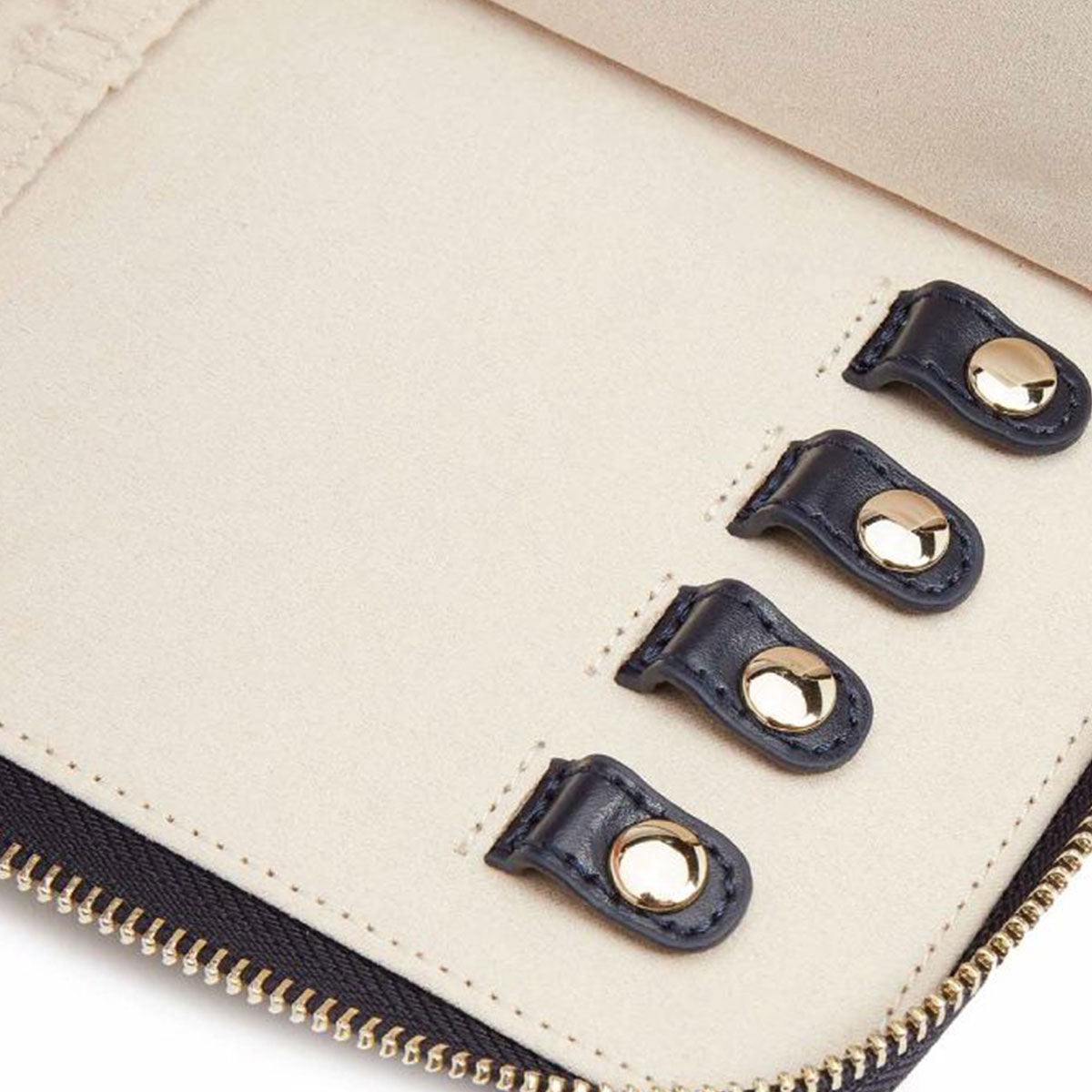 The WOLF 1834 Maria Jewellery Portfolio from WOLF, designed in a beige tone, is open to reveal four key holders crafted from black leather and featuring gold metal snaps. The interior also boasts a beige lining, ideal for those who admire smooth leathers.