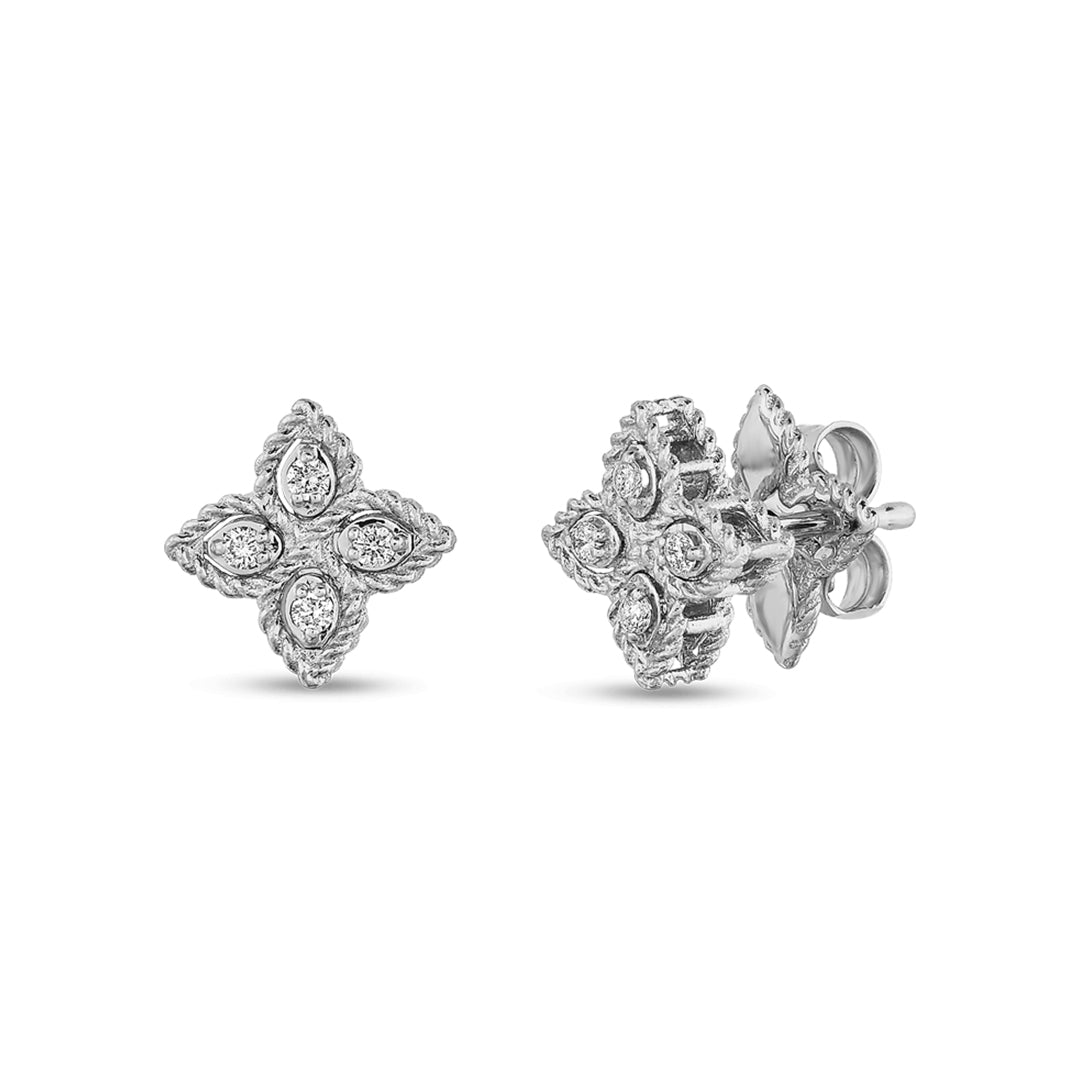 The Roberto Coin 18K White Gold Small Flower Princess Diamond Stud Earrings feature an 8mm x 8mm floral design, with four teardrop diamonds as petals around a central round diamond. They include a textured border, secure post and butterfly backings, and have a total of 0.07 TCW.