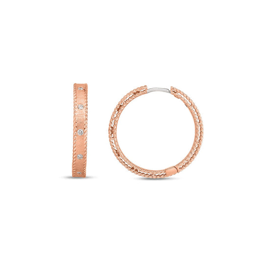 A luxurious 18K rose gold Princess Diamond Satin Ring Band by Roberto Coin. One side of the ring reveals small round diamonds, while another angle showcases its circular shape and intricate texture.