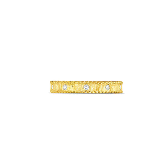 The Roberto Coin 18K Yellow Gold Princess Diamond Ring Band by Roberto Coin showcases a textured design with five evenly spaced small round diamonds set in the band, displayed against a plain white background.