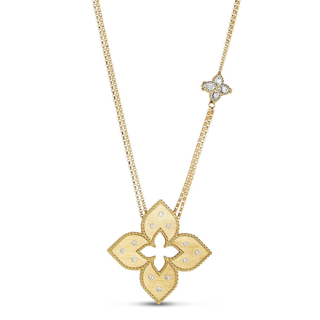 The Roberto Coin Venetian Princess 18K Yellow Gold Diamond Flower Long Necklace Pendant features a large, textured quatrefoil and an off-center floral charm with 0.20 TCW diamonds on a fine, adjustable gold chain.
