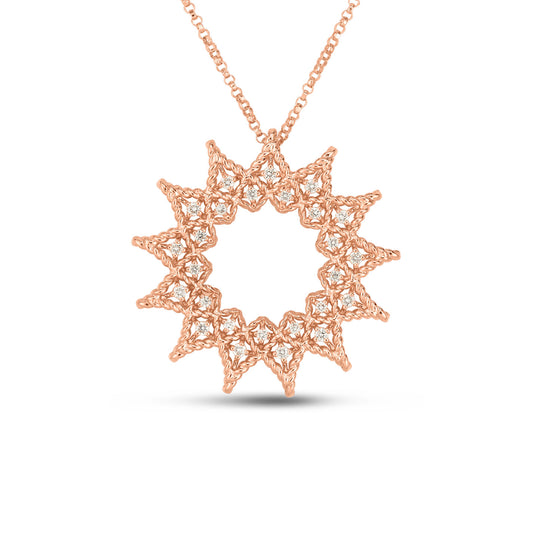 The Roberto Coin 18K Rose Gold Diamond Open Roman Barocco Sunburst Necklace Pendant, crafted in exquisite 18k rose gold, showcases a circular pendant with interwoven star-shaped patterns adorned with round diamonds. Its intricate design exudes a delicate and elegant appearance.