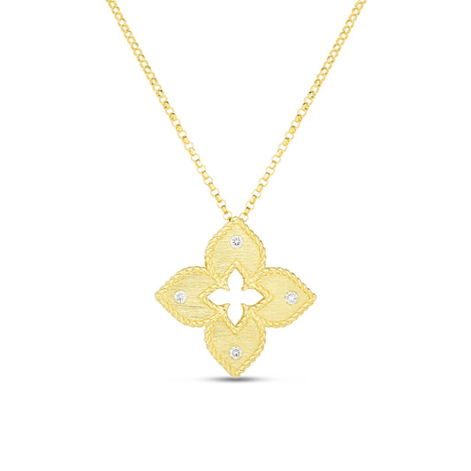 The Roberto Coin Petite Venetian Princess Necklace features an 18K yellow gold satin-finish four-petal flower pendant with diamond accents, gracefully suspended from an 18" delicate gold chain.